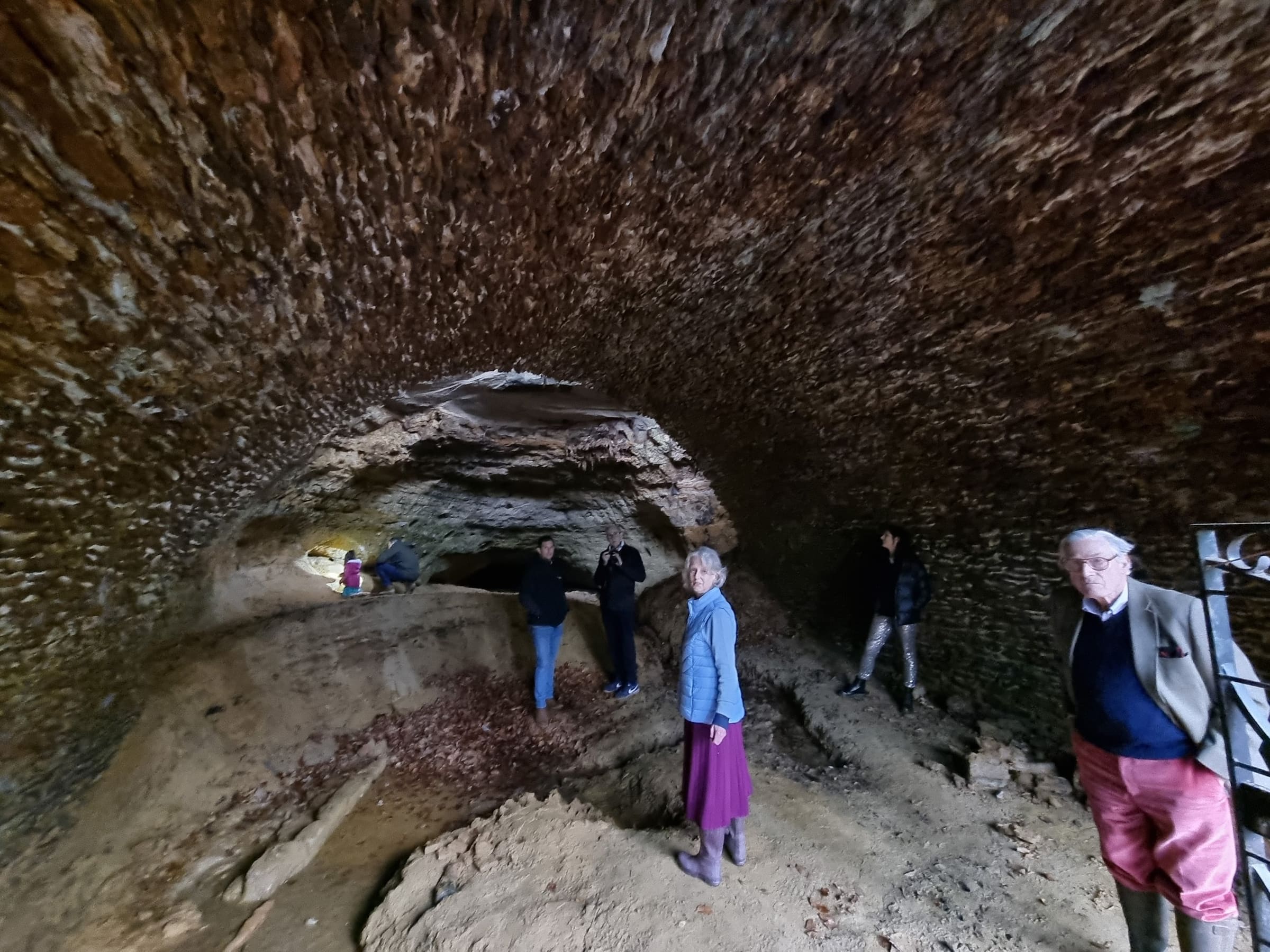A small group on a guided tour of the cave